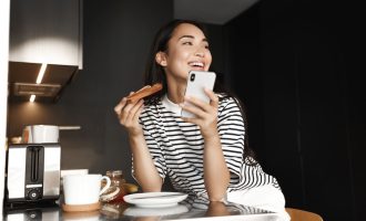 Image Happy Asian Woman Eating 600w 2001960107 1