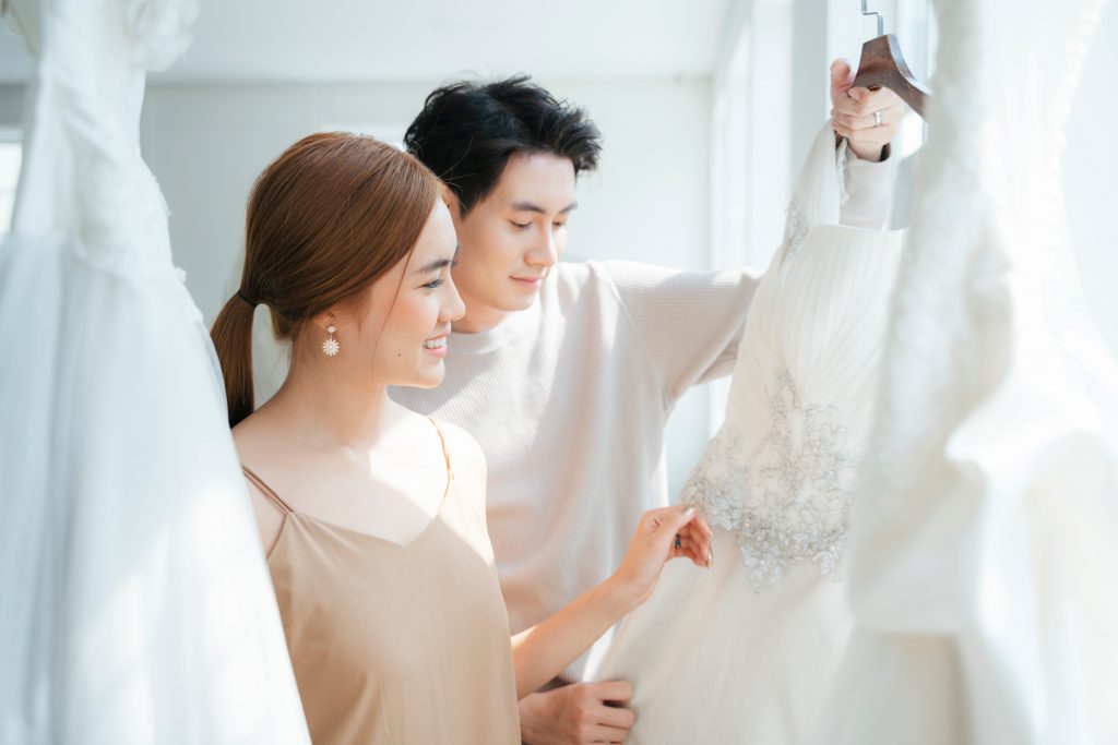 Couple,visit,wedding,studio,to,choose,their,wedding,costume,,a