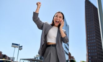 Young,happy,excited,asian,business,woman,entrepreneur,winner,standing,on